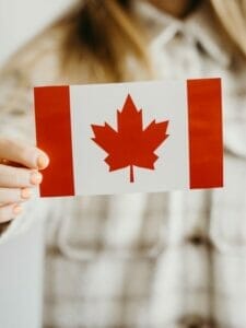 person holding a canadian flag