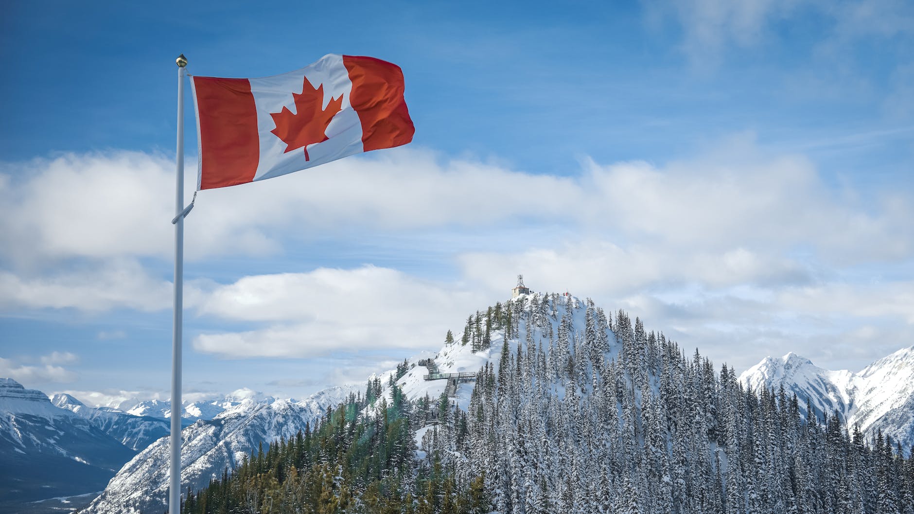 flag of canada and mountains